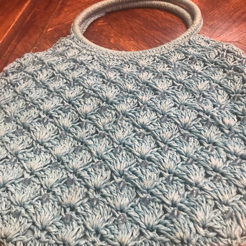Blue net bag with a round handle